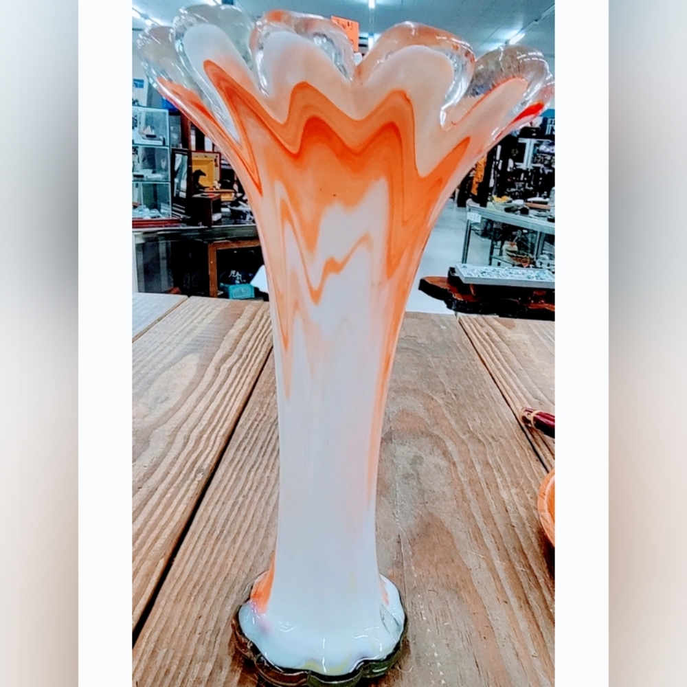 Tall Murano vase, orange and white swirls, scalloped upper edge.